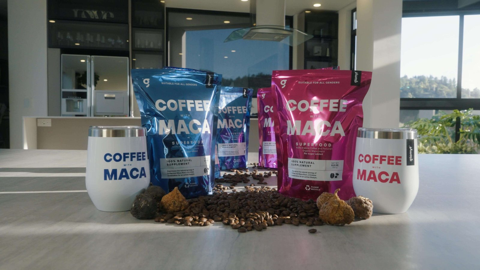 Glomyt Blue and Pink bags with tumblers, coffee beans and maca roots