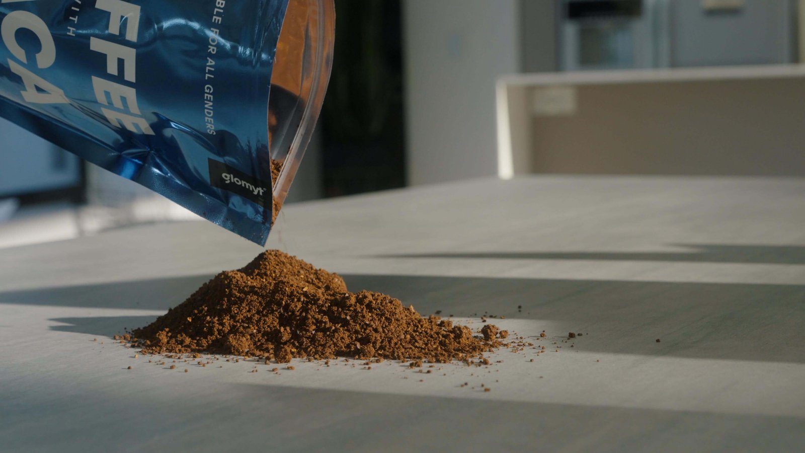 Glomyt Blue coffee grounds pouring from the bag